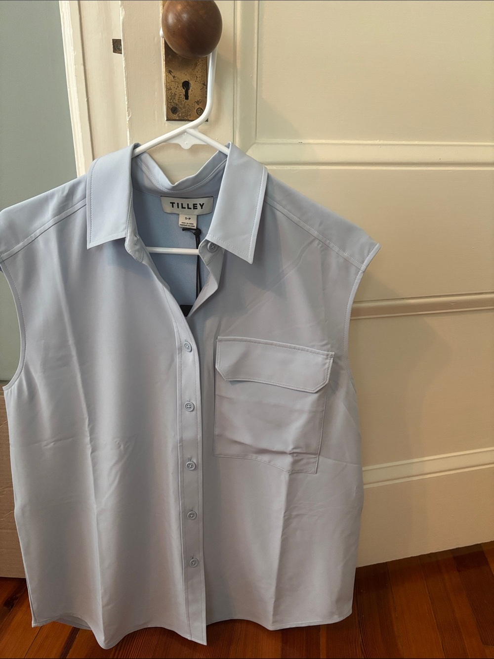 New with tag Tilley sleeveless tech shirt in baby blue